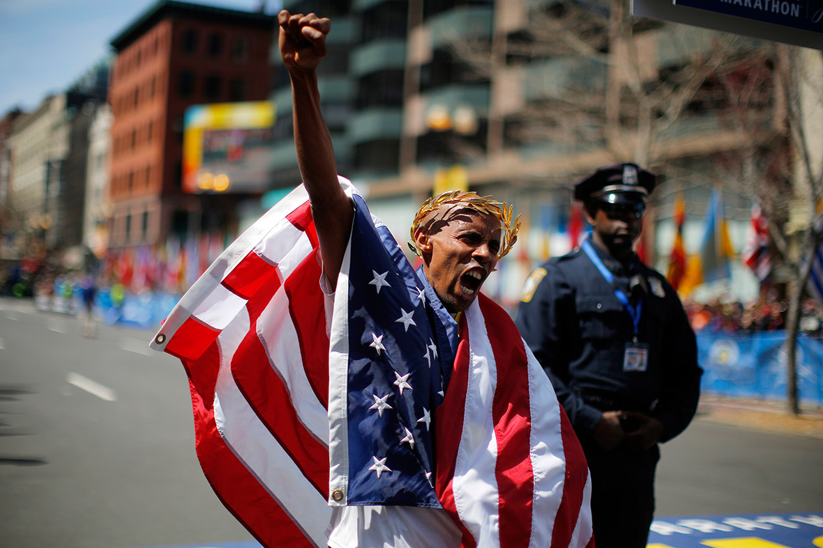 Meb Keflezighi of the US reacts after winning the men's division of the Boston Marathon, becoming the first American man to win the race in three decades