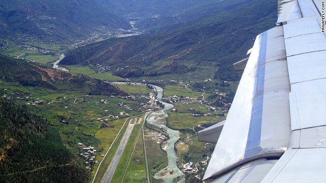 The plunge into this steep valley containing secluded Bhutan's only international airport is as beautiful as it is challenging -- only eight pilots in the world are qualified to land here.