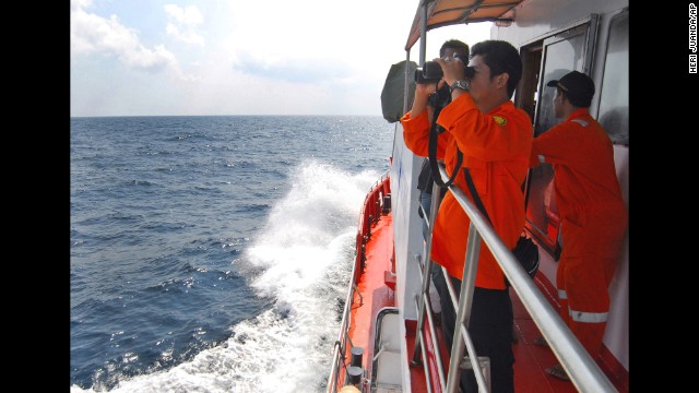 A member of the Indonesian National Search and Rescue Agency scans the horizon in the Strait of Malacca off Sumatra island, Indonesia, on Wednesday, March 12.