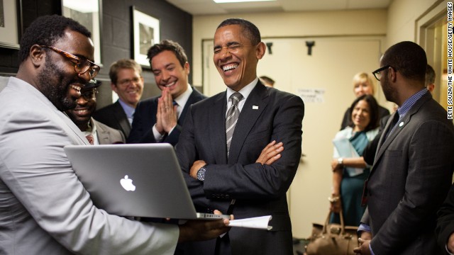 President Barack Obama lets out a laugh as he is briefed by host Jimmy Fallon and his producers on the "Slow Jam the News" segment before his appearance on "Late Night with Jimmy Fallon" in April 2012. 