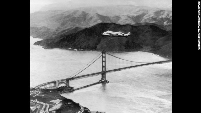 The Lockheed Electra, piloted by Amelia Earhart and Fred Noonan, flies over the Golden Gate Bridge at the start of a round-the-world flight on March 17, 1924. The two vanished during a similar flight in 1937.