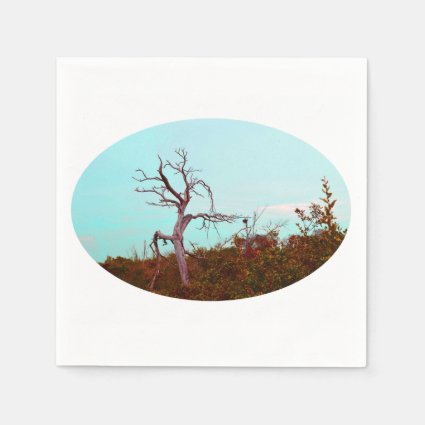 dead tree against green leaves sky teal disposable napkin