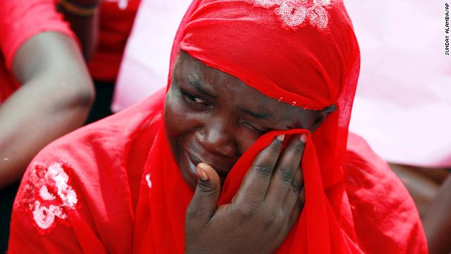 A woman attends a demonstration Tuesday, May 6, that called for the Nigerian government to rescue nearly 300 schoolgirls who were kidnapped last month in Chibok, Nigeria. The girls were taken by the Islamist militant group Boko Haram.