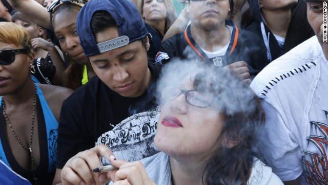 Partygoers listen to live music and smoke pot on day two of the annual 420 Rally in Denver on Sunday, April 20, 2014. 420 is a once clandestine term used in pot culture to refer to marijuana. 