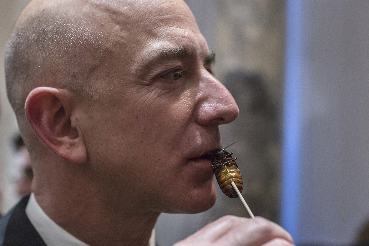 Amazon Chairman and CEO Jeff Bezos samples cooked cockroach at the 110th Explorers Club Annual Dinner at the Waldorf Astoria in New York