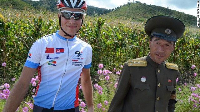 Swedish racer Christian Bertilsson with North Korean police on a countryside road.