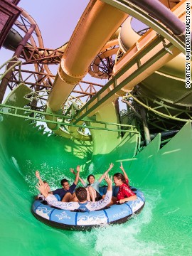 At Aquaventure Waterpark in Dubai, the Aquaconda contains the world's first slide-within-a-slide, comprising an enclosed tube slide that weaves in and out of the framework of a flume-style ride. 