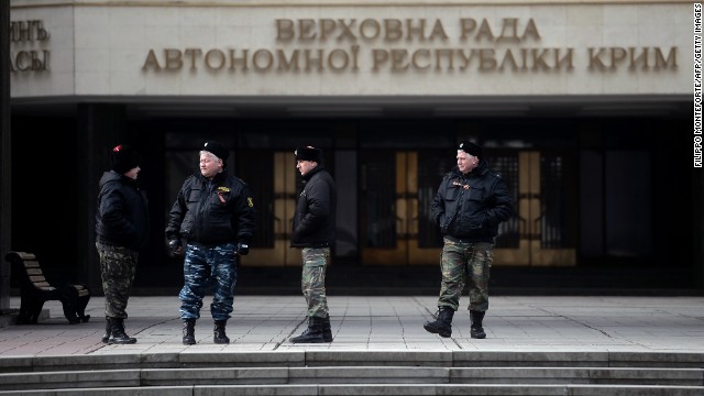 Cossacks stand guard at Crimea's regional parliament building in Simferopol on March 12.