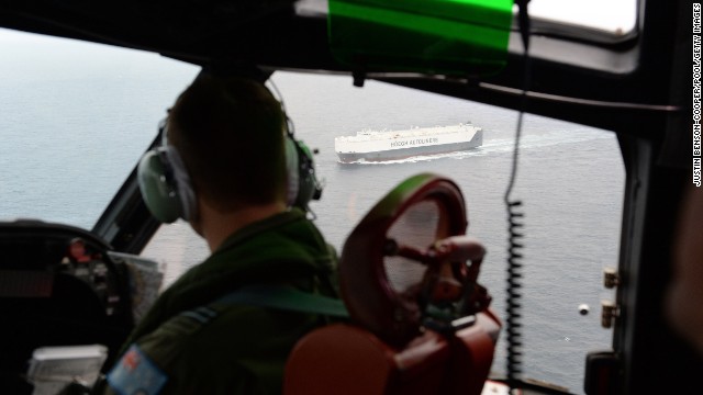 A member of the Royal Australian Air Force looks down at the Norwegian merchant ship Hoegh St. Petersburg, which is taking take part in the search for possible debris from Malaysia Airlines Flight 370 on Friday, March 21. The Malaysia Airlines jet disappeared during a March 8 flight from Kuala Lumpur to Beijing. Surveillance planes are looking for two objects spotted by satellite imagery in the remote and treacherous waters of the southern Indian Ocean more than 1,400 miles from Australia's west coast of Australia.