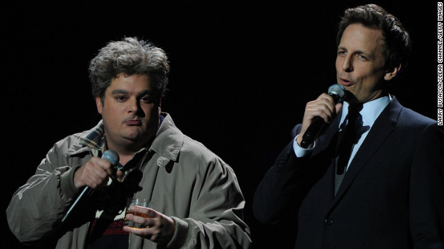 On December 12, 2012, Bobby Moynihan, left, and Meyers perform onstage at New York's Madison Square Garden at the '12-12-12' concert benefiting The Robin Hood Relief Fund to aid the victims of Superstorm Sandy.
