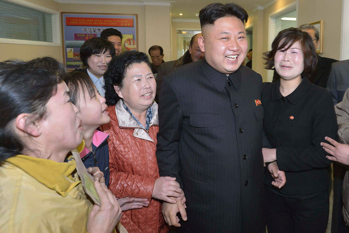 22 March 2014: Kim Jong-un smiles as women surround him at the Ryugyong Dental Hospital and Okryu Children's Hospital in Pyongyang