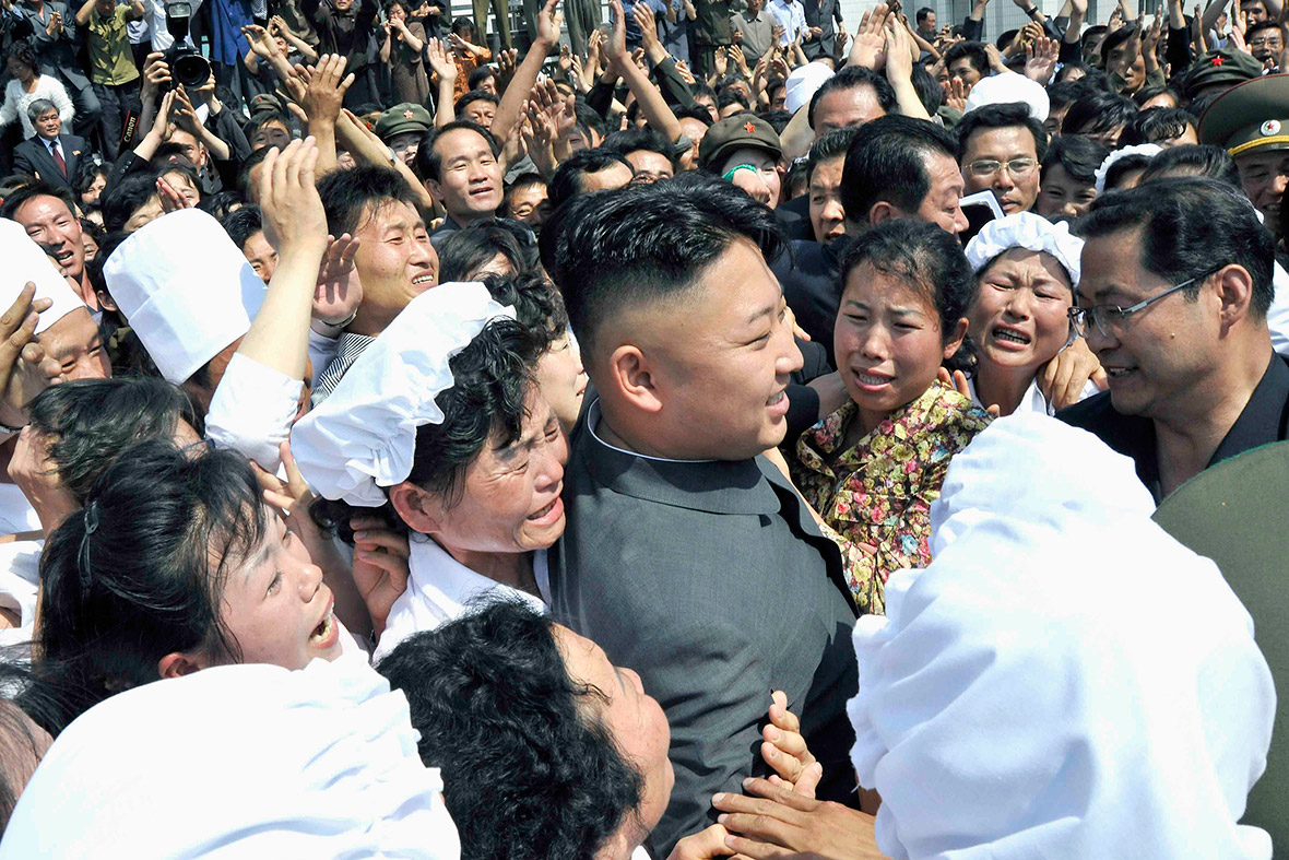 8 June 2013: Adoring fans mob Kim Jong-un as he pays a visit to the Pyongyang Essential Foodstuff Factory