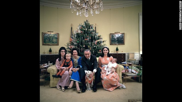 This 1968 Christmas photo shows President Lyndon B. Johnson posing with his family, his daughters grown and married, at the White House. With him, from left, daughter Luci Johnson Nugent holding Lyn Nugent; and wife Lady Bird Johnson. Sitting to his right; daughter Lynda Johnson Robb holding Lucinda Robb. 