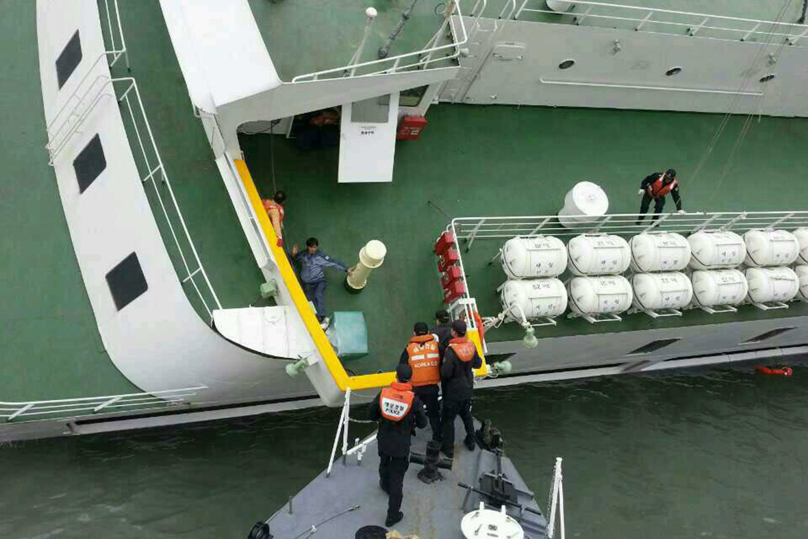 Passengers are rescued from the sinking ferry by the Republic of Korea Coast Guard