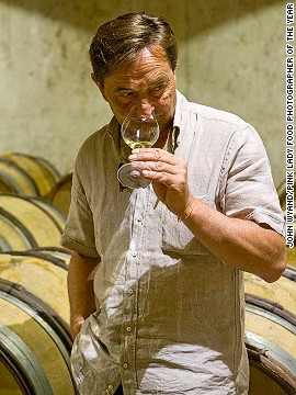Dominique Lafon, managing director of the Comtes Lafon vineyard estate in eastern France, tastes wine in his cellars in this image by John Wyand. The image took first prize in the Errazuriz Wine Photographer of the Year -- People category.