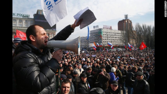People shout slogans during a pro-Russia rally in Donetsk, Ukraine, on Sunday, March 9. Pro-Russian forces have taken control of Ukraine's autonomous Crimean region, prompting criticism from Western nations and the Ukrainian interim government. The standoff has revived concerns of a return to Cold War relations. 