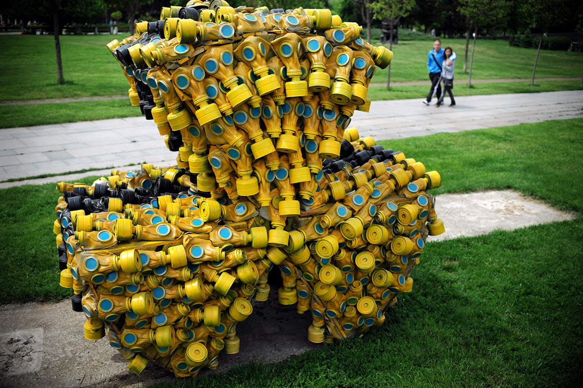 More than 400 gas masks are formed into the radiation symbol at a park in Sofia, Bulgaria.