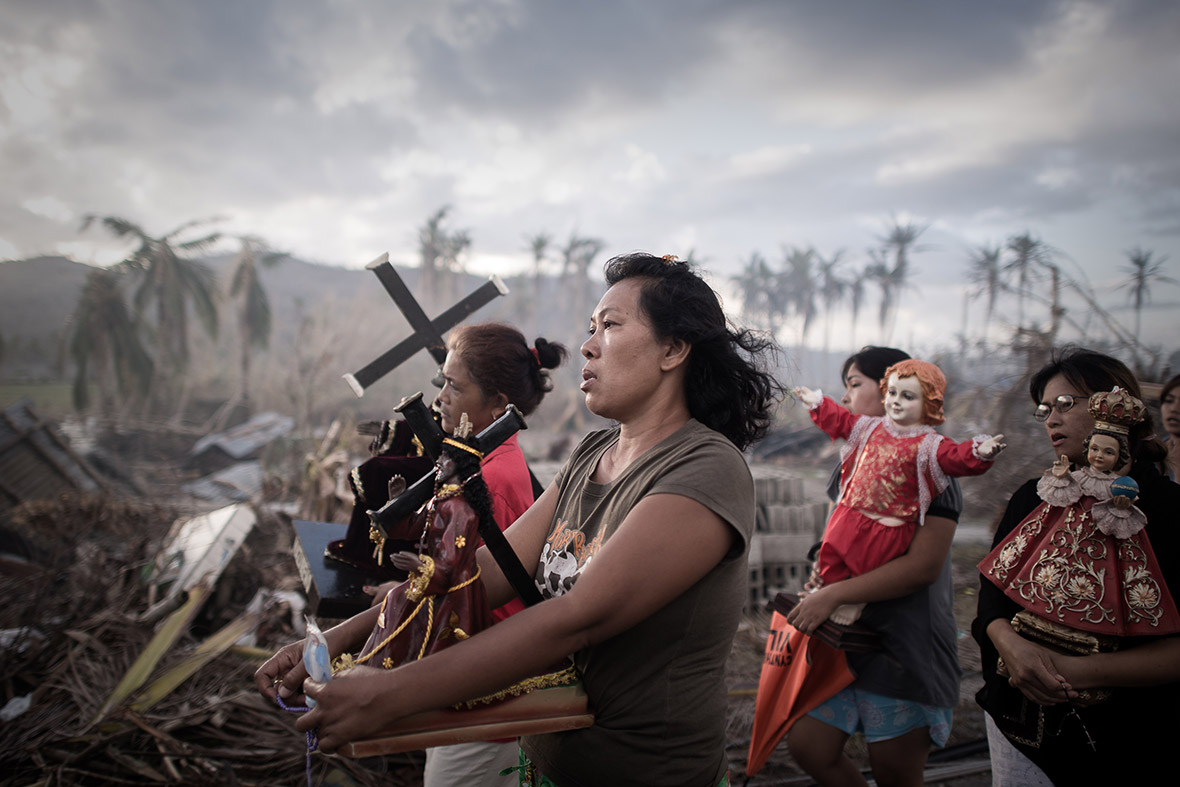 November 18, 2013: Survivors of Super Typhoon Haiyan march during a religious procession in Tolosa on the eastern Philippine island of Leyte