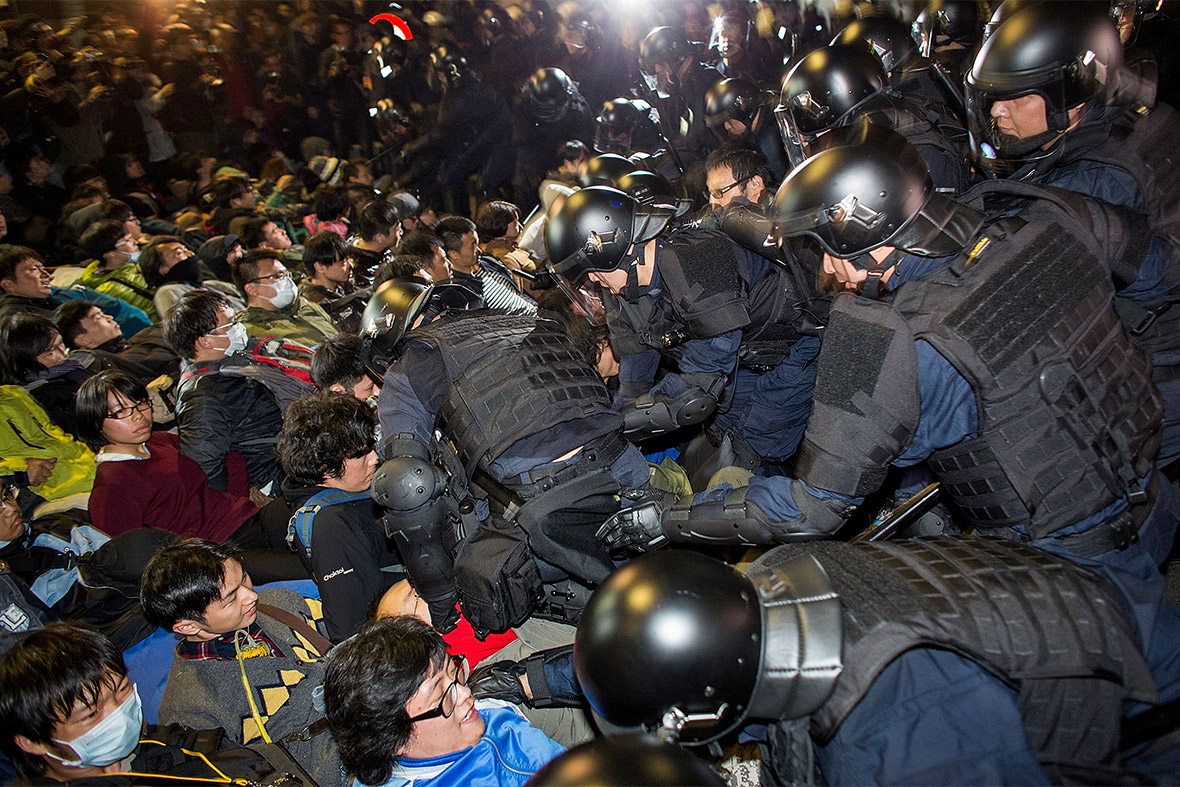 March 24, 2014: Riot police wade into a crowd of students protesting outside the executive yuan