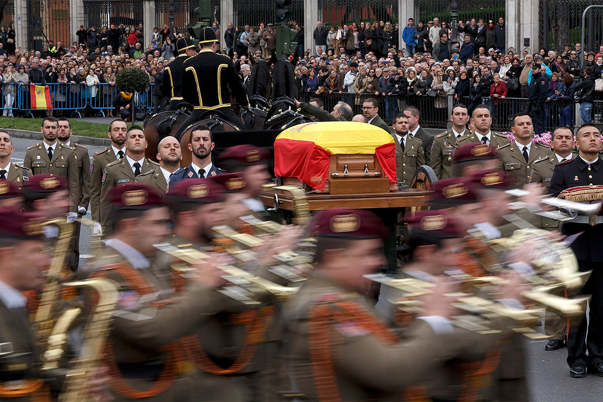 Soldiers march at Cibeles Square in Madrid as the coffin of former Spanish prime minister Adolfo Suarez makes its way to Avila for his burial