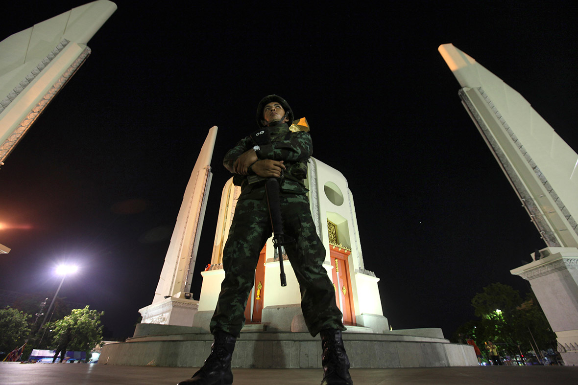 A Thai soldier stands guard at the Democracy Monument in Bangkok after a coup