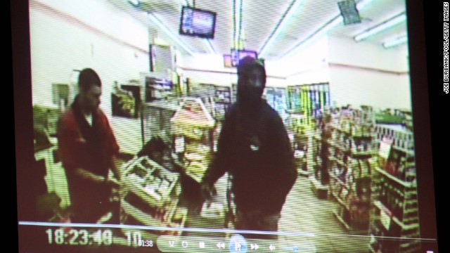 A video entered as evidence is displayed on June 24. It shows Martin, right, at a 7-Eleven on the night of his shooting.