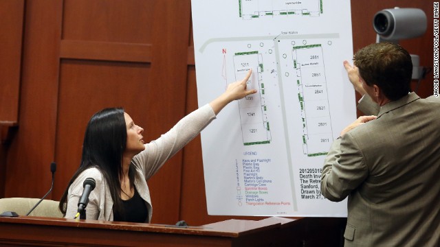 Witness Jennifer Lauer points to where her former home was in the Retreat at Twin Lakes community during questioning by defense attorney Mark O'Mara on June 27. Lauer called 911 on the night of the shooting.