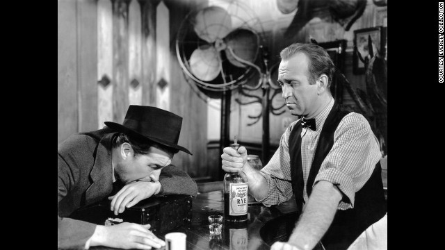 With World War II coming to an end, Hollywood turned to dark subject matter, such as alcoholism in Billy Wilder's "The Lost Weekend." Star Ray Milland, left, won the best actor award as a writer on a binge. Howard Da Silva was the bartender.