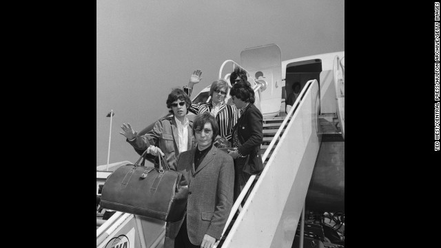 The Rolling Stones leave London on a flight to New York on June 23, 1966, before the start of their fifth North American tour.