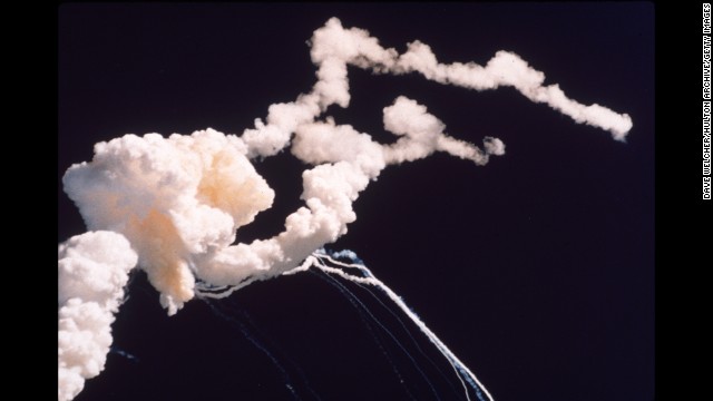 Debris and smoke fills the sky after the space shuttle Challenger explodes above Florida's Kennedy Space Center in January 1986.