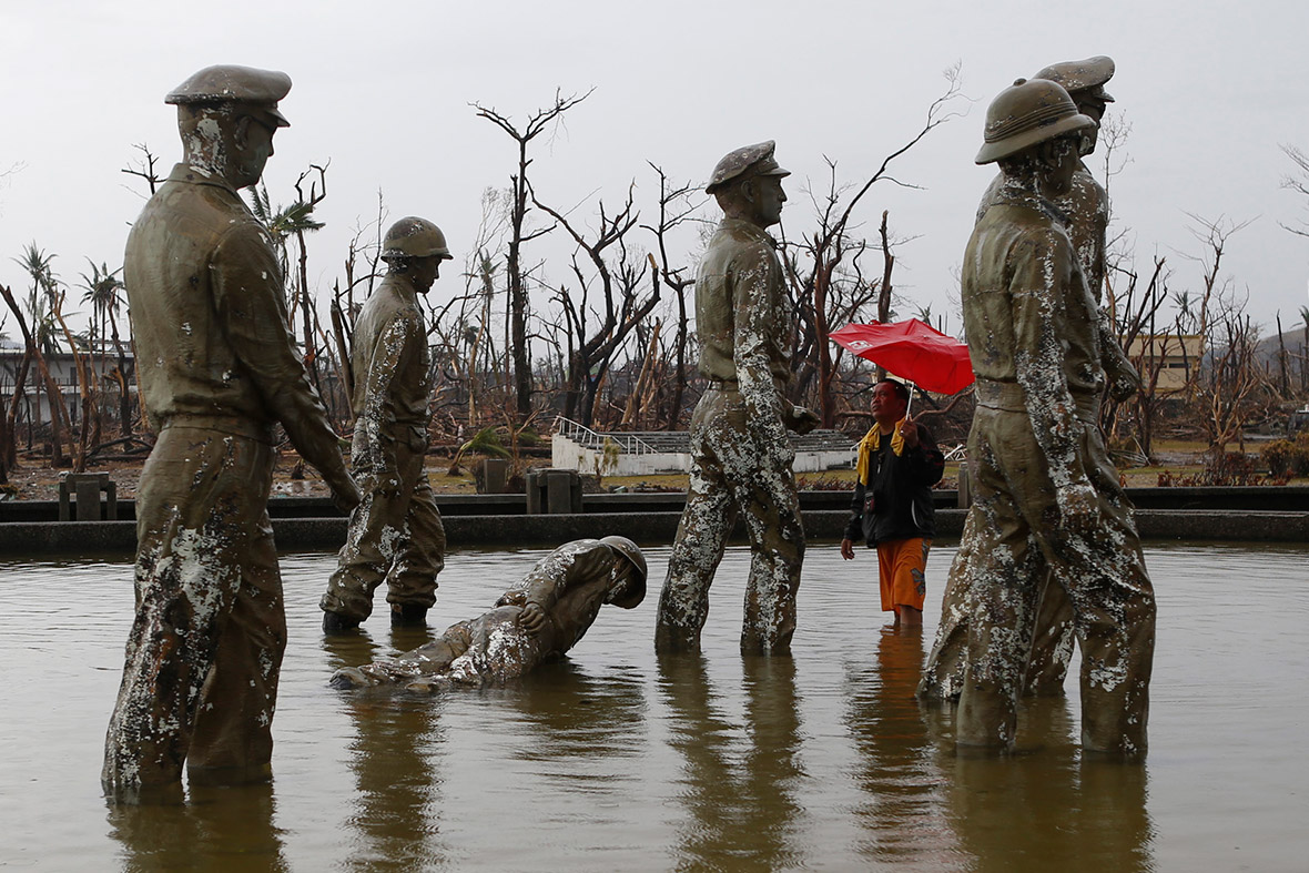 November 12, 2013: One of the statues commemorating the landing of US General Douglas MacArthur and his Allied forces lies face down in the water after being toppled by super typhoon Haiyan in Palo, Leyte province