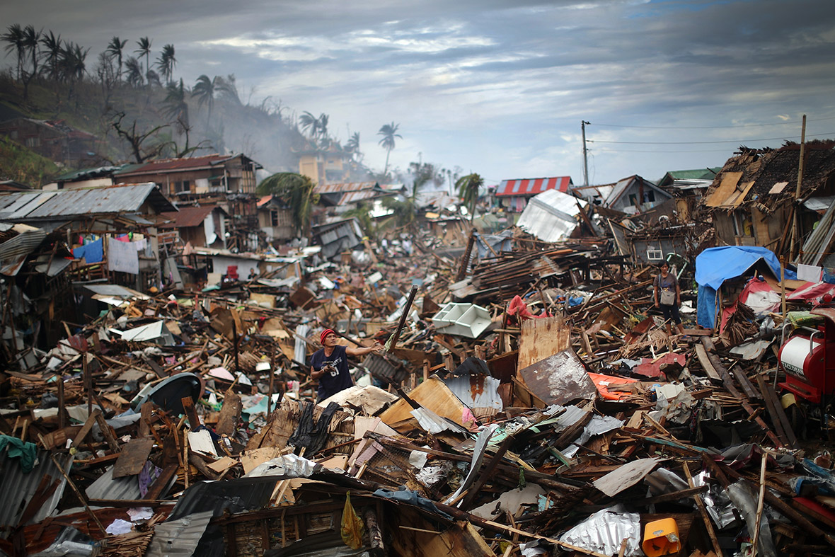 November 17, 2013: A man sifts through debris in what was a river running through central Tacloban