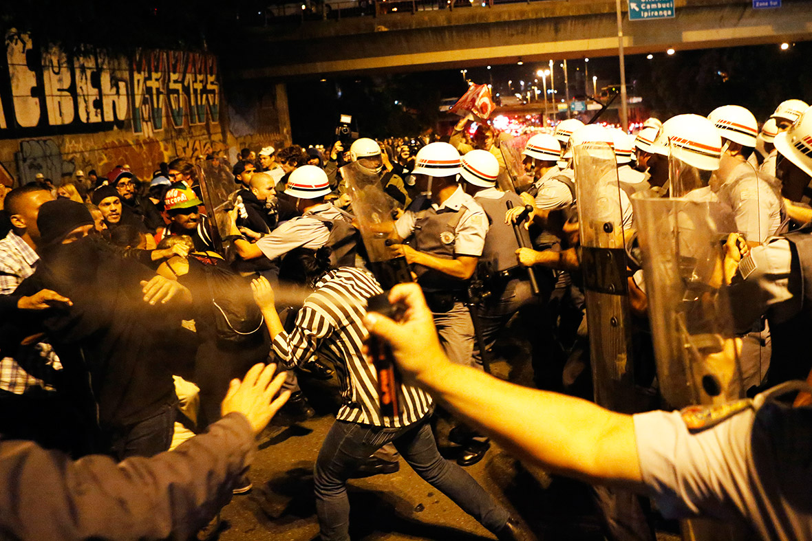 Demonstrators clash with military police during a protest against the 2014 Brazil World Cup, in Sao Paulo