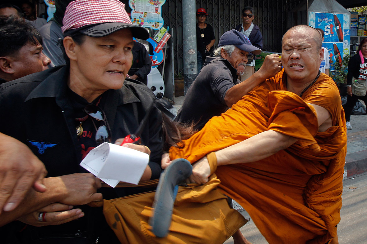 A Buddhist monk is attacked by members of the pro-government 