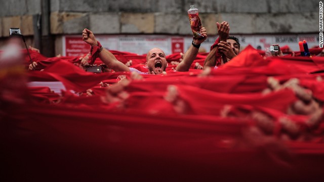 Revelers kick off the San Fermin festival with a messy party in Pamplona's town square on July 6.