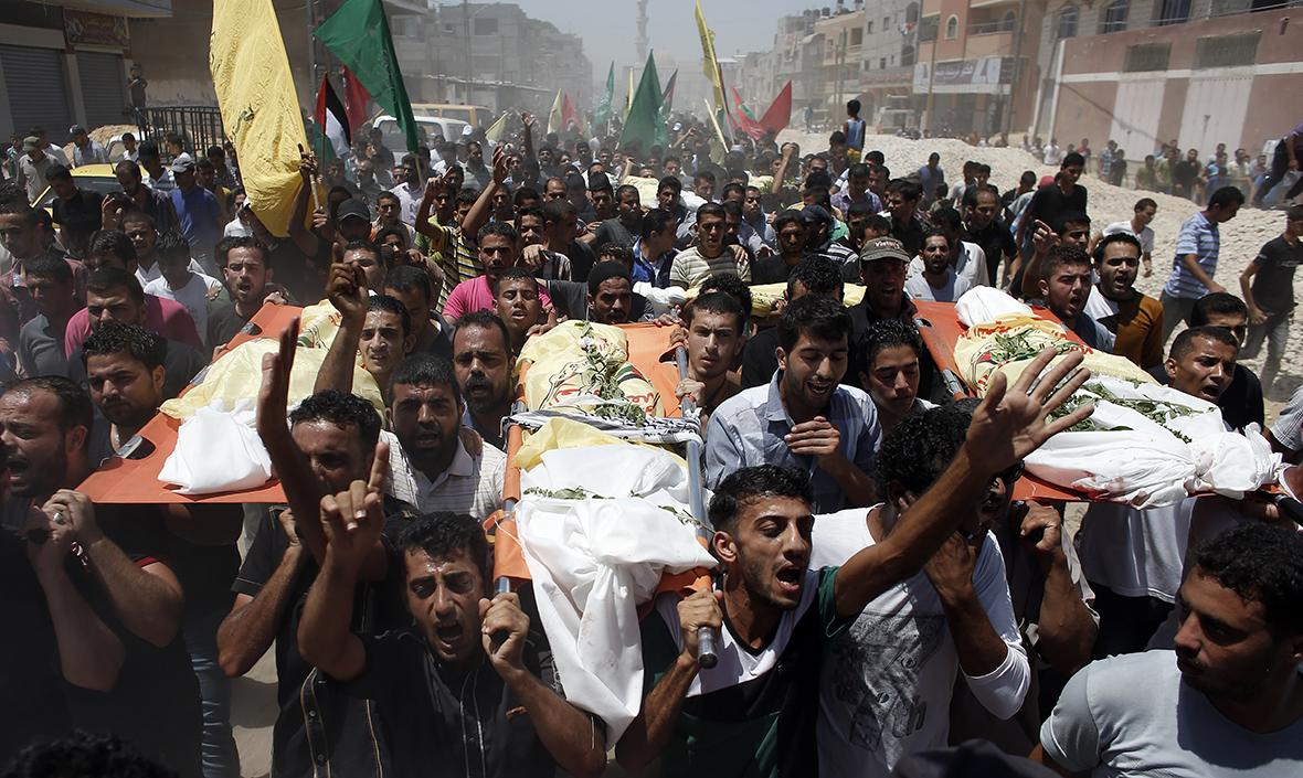 Relatives and friends of the al-Kaware family carry their bodies to the mosque during their funeral in Khan Younis in the Gaza Strip. The father, a member of the Fatah movement, and his six young sons were all killed in an Israeli air strike that targeted their home