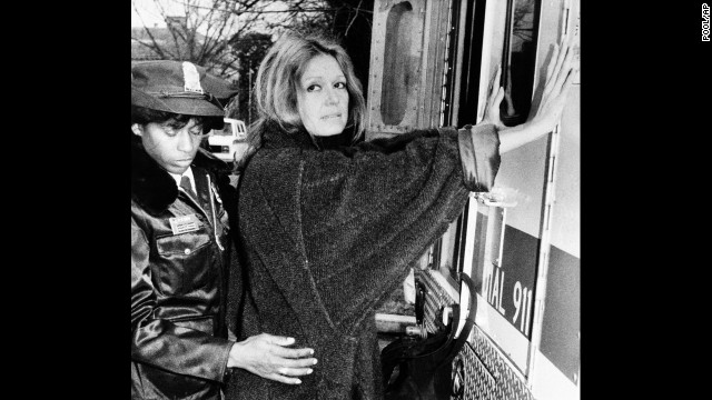A police officer arrests Steinem in 1984 during an anti-apartheid protest outside the South African Embassy in Washington.
