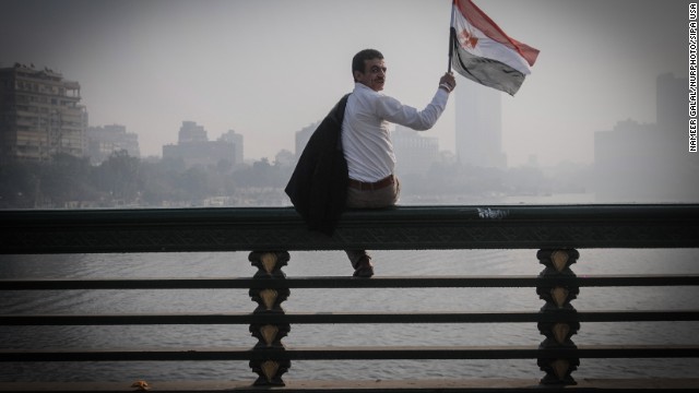 A man waves an Egyptian flag during a rally. 