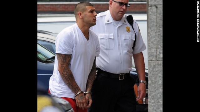 Hernandez is brought into the Attleboro, Massachusetts, District Court for his arraignment on June 26, 2013. He was charged with first-degree murder in Lloyd's death. Hernandez was release by the Patriots less than two hours after his arrest.