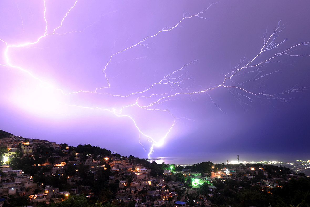 Lightning strikes during an evening thunderstorm in the Haitian capital Port-au-Prince