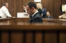 South African Olympic and Paralympic athlete Oscar Pistorius sits in the dock during his murder trial in the North Gauteng High Court in Pretoria