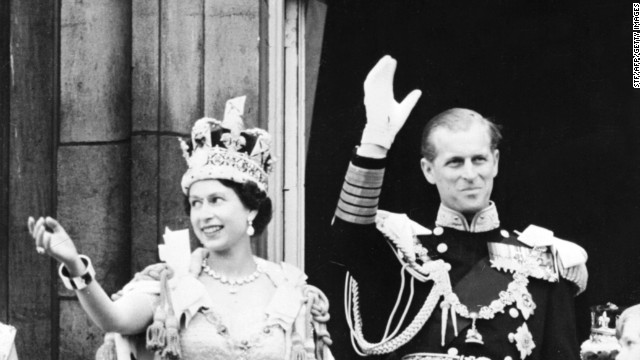 Queen Elizabeth II, with her husband Prince Philip, waves to the crowd on June 2, 1953, after being crowned at Westminster Abbey in London. 