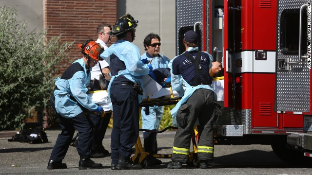 Seattle firefighters load a victim into an ambulance near the scene of the shooting.