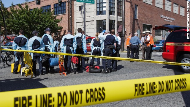 Emergency personnel gather near the scene of the shooting. 