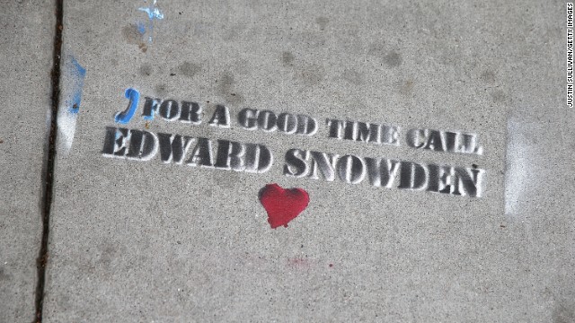 Graffiti sympathetic to Snowden is stenciled on the sidewalk in San Francisco on June 11.