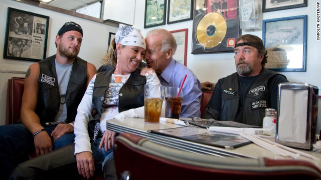 Joe Biden talks to customers, including a woman who pulled up her chair in front of where he was sitting, during a campaign stop at Cruisers Diner in Seaman, Ohio, in September 2012.