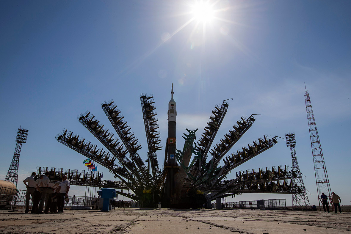 A multiple-exposure picture shows service towers moving towards the Soyuz TMA-13M spacecraft on its launch pad at Baikonur cosmodrome. The Soyuz is scheduled to travel to the International Space Station on 29 May