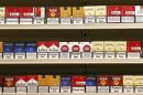 Cigarette packs are presented in a simulated tobacconist shop at a news conference in Paris
