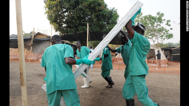 Health specialists work March 31 at an isolation ward for patients at the facility in southern Guinea.