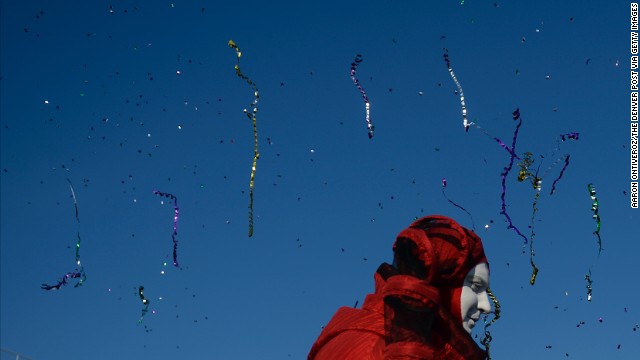 Streamers and confetti fly through the air as performers entertain fans February 8 at the Olympic village.